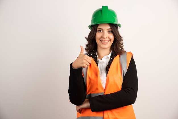 Woman industrial worker showing thumbs up