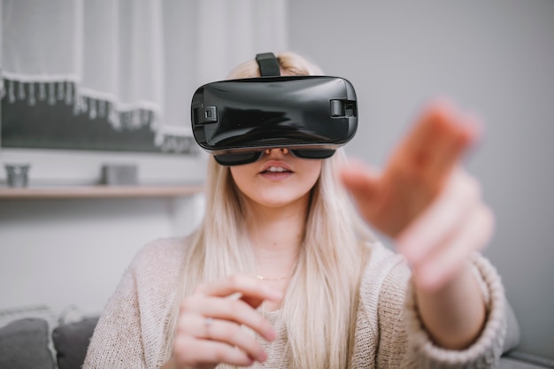 Woman interacting with virtual reality