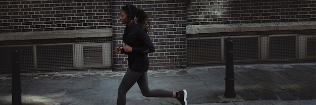 Woman jogging through the city