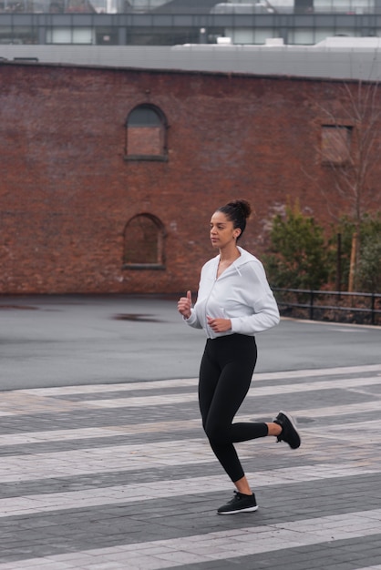 Free photo woman jogging in the winter time