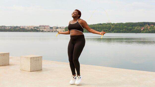 Woman jumping rope outdoors