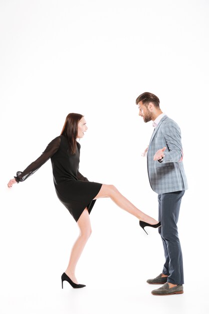 Woman kicking her boyfriend's nuts