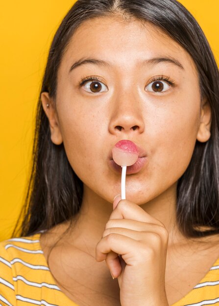 Woman kissing a chupa chups