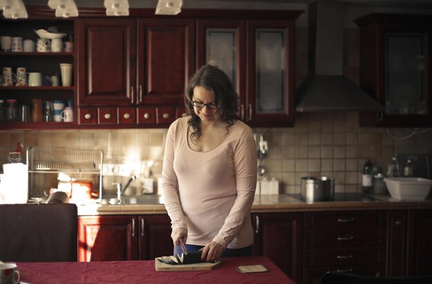 woman in the kitchen prepares a salad