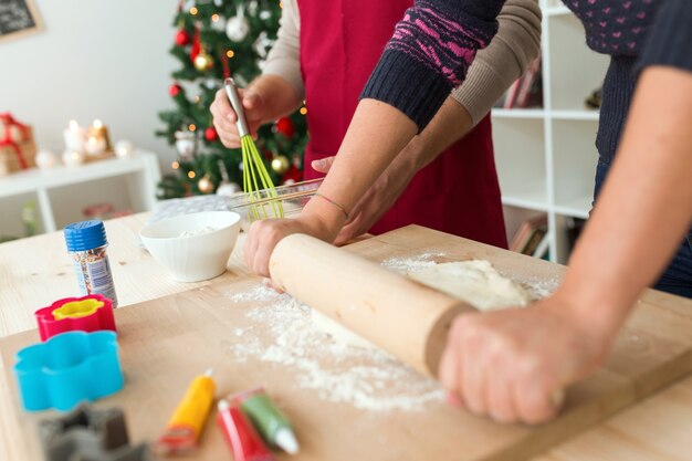 Woman kneading with a roller