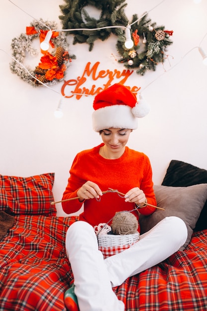 Woman knitting on Christmas