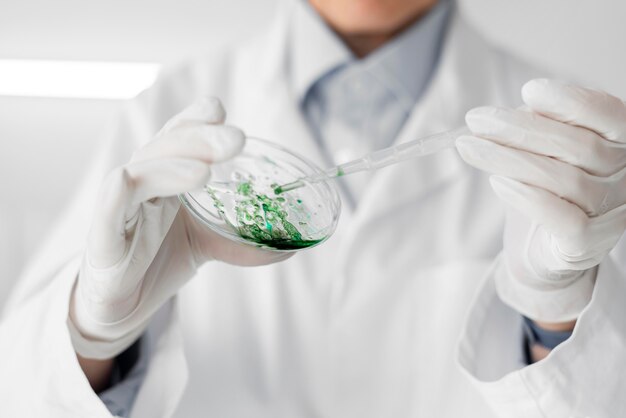 Woman in laboratory doing experiments close up