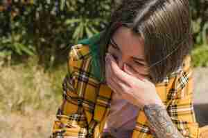 Free photo woman laughing outdoors