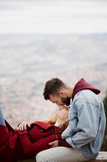 Woman laying on affectionate boyfriend