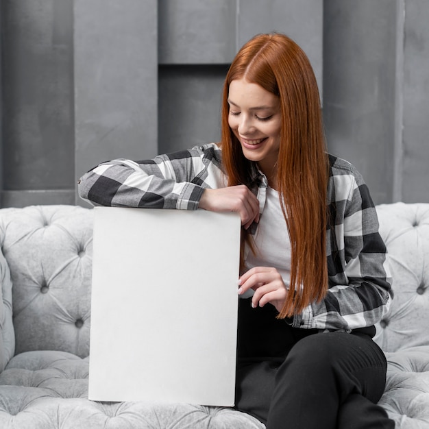 Woman leaning on blank paper