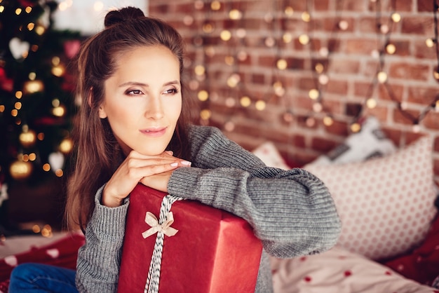 Woman leaning on a gift