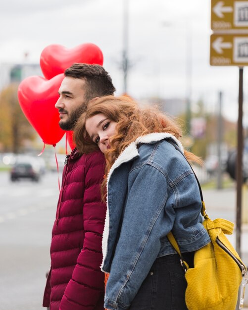 Woman leaning on mans shoulder