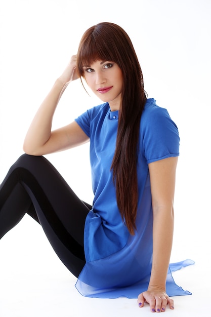 Free photo woman in leggings sitting on the floor