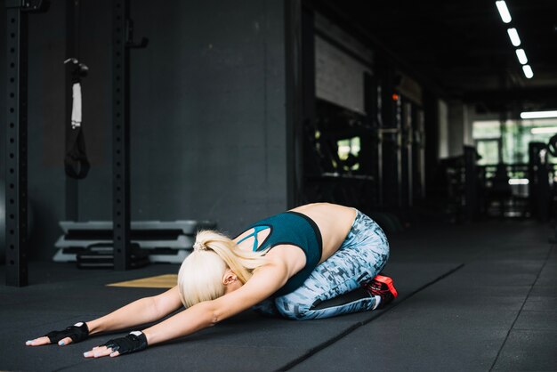 Woman in leggings stretching