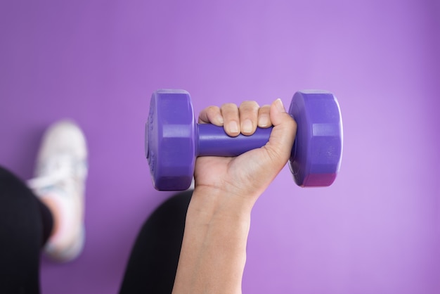 Woman lifting a dumbbell