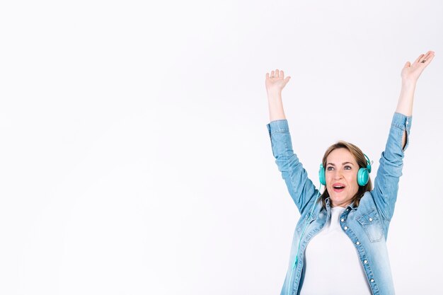 Woman listening to music and cheering