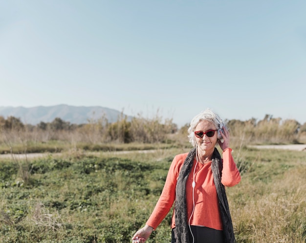 Woman listening to music in nature