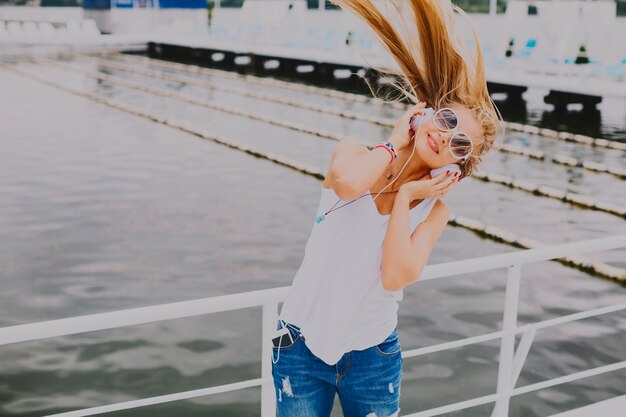 Woman listening to music and shaking head