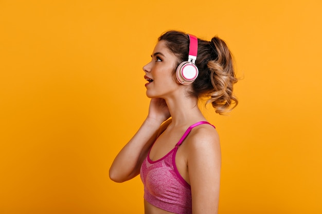 woman listening to music while training