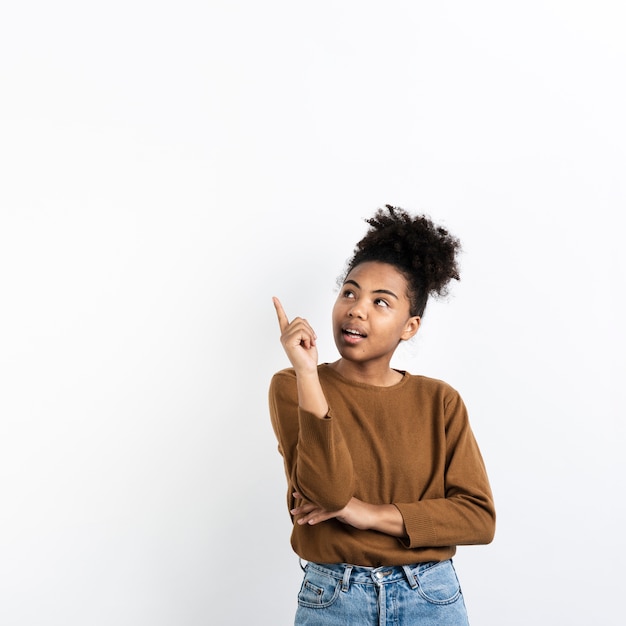 Woman looking away and pointing