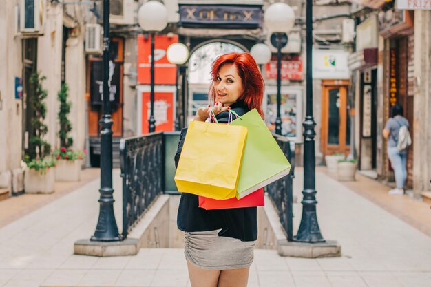 Woman looking back at camera while shopping