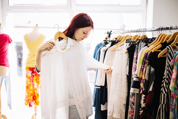 Woman looking at blouse