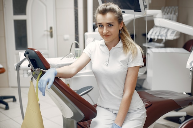 Woman looking at the camera. Woman looking at the camera.Dentist is waiting for the patient