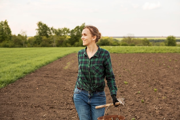 Woman looking at a crop land