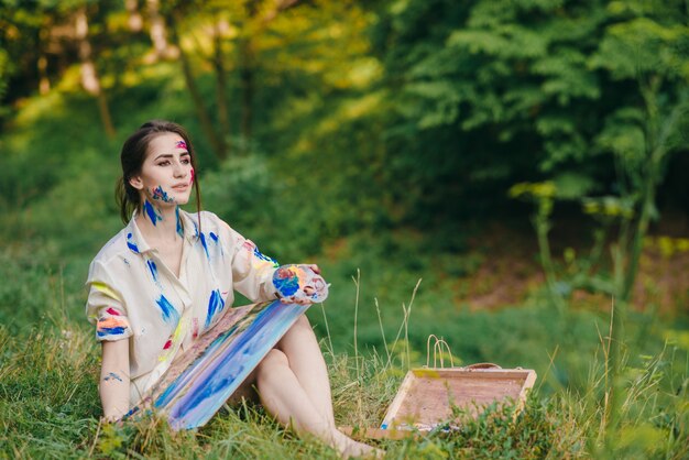 Woman looking forward with a picture on her legs