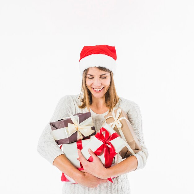 Woman looking at gift boxes in hands