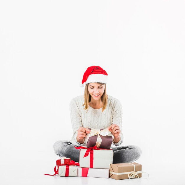 Woman looking at gifts on floor