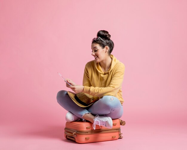 Woman looking at her plane tickets