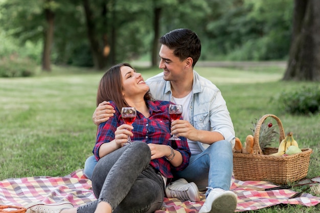 Free photo woman looking at his man while laying on his arms