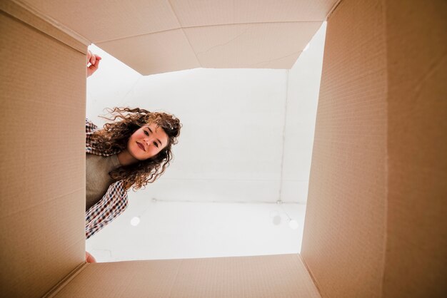 Woman looking inside box