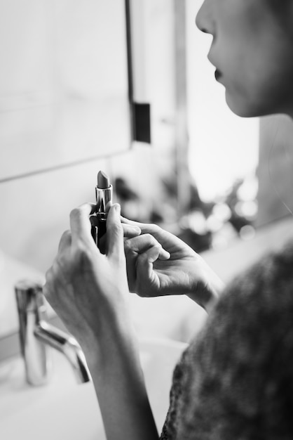 Woman looking at the lipstick