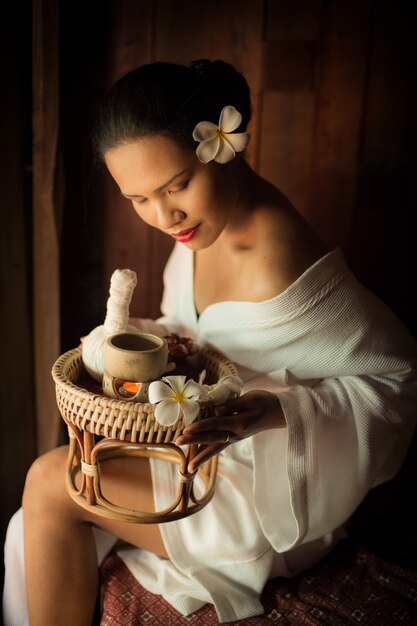 Woman looking at massage basket