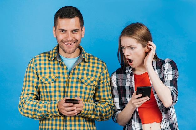 Woman looking shocked while looking at her friend's phone