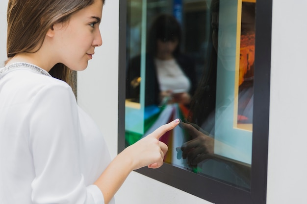 Woman looking at shop window