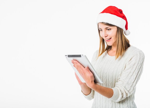 Woman looking at tablet in hands 