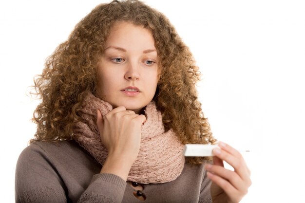 Woman looking thermometer