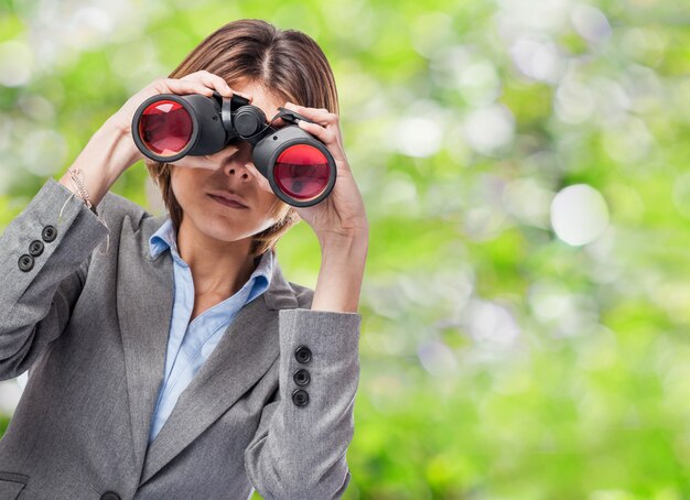 Woman looking through binoculars