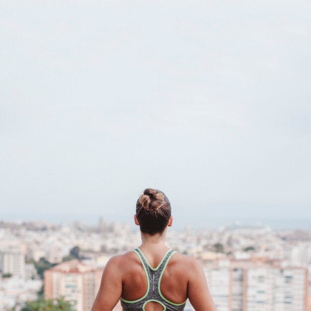 Woman looking towards city