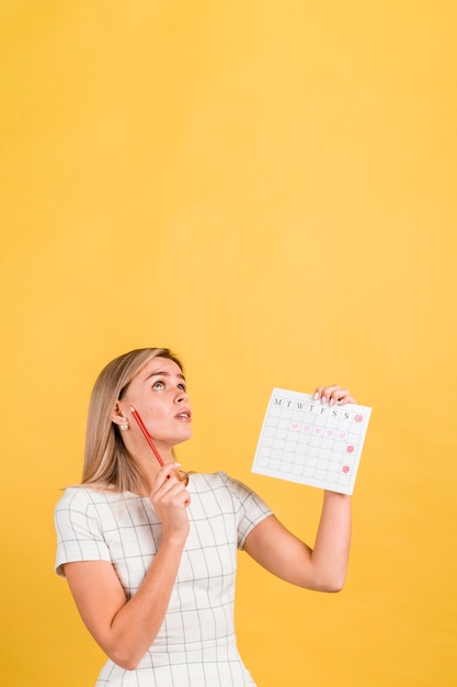 Woman looking up and thinking copy space