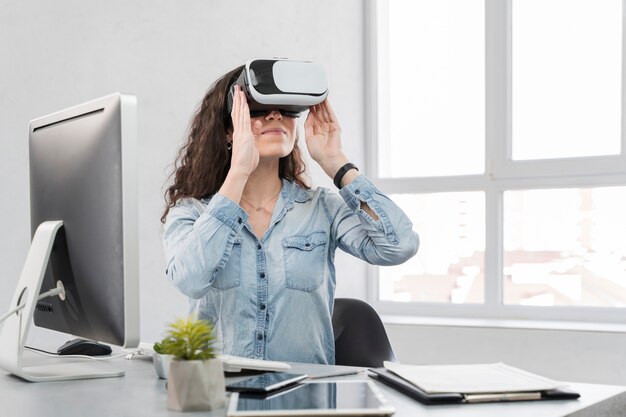 Woman looking with vr device and feeling happy
