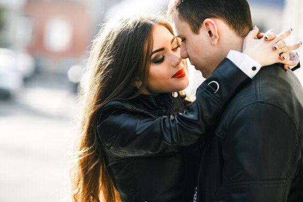 Woman in love with hands on her boyfriend's neck