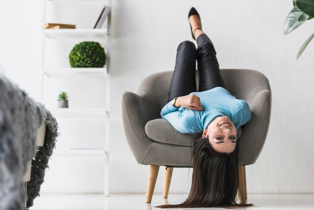 Woman lying in armchair