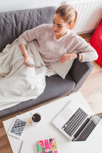 Free photo woman lying on couch