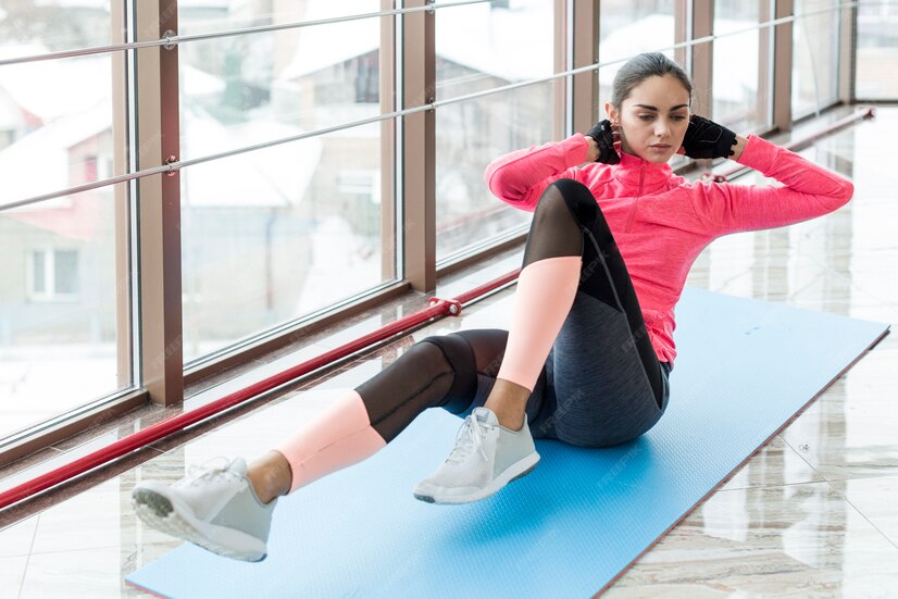 woman lying exercising abs 23 2147778451