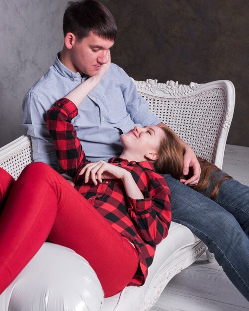 Woman lying on man lap