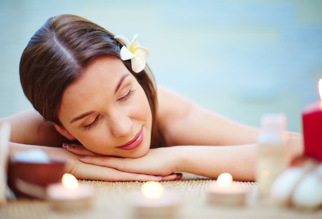 Woman lying on the massage desk